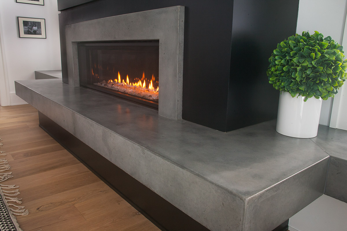 A grey fireplace designed by Concrete Central